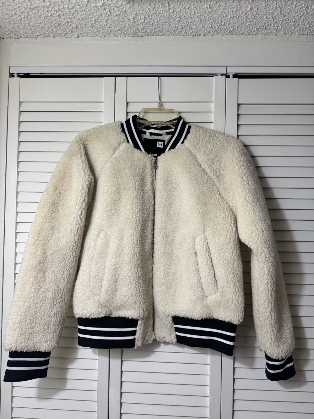 Under Armour Cream Sherpa Bomber Jacket with Black-White Striped Trim